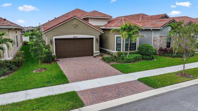 mediterranean / spanish home with a front lawn and a garage