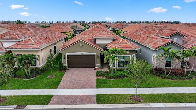 mediterranean / spanish-style house with a garage and a front lawn