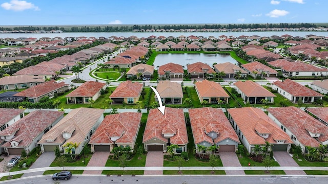 birds eye view of property featuring a water view