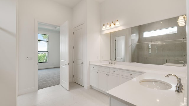 5237 Saint Vincent Ln, Westlake, FL 33470 - full bath featuring a stall shower, double vanity, and baseboards