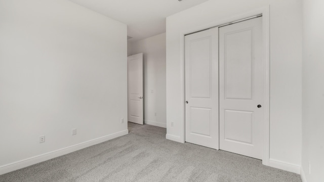 5237 Saint Vincent Ln, Westlake, FL 33470 - unfurnished bedroom with carpet, a closet, and baseboards