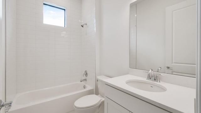 full bathroom featuring vanity, toilet, and tiled shower / bath combo