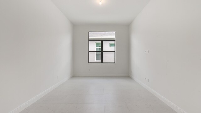 5237 Saint Vincent Ln, Westlake, FL 33470 - spare room with baseboards and light tile patterned floors