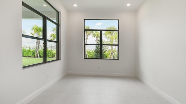 5237 Saint Vincent Ln, Westlake, FL 33470 - unfurnished room featuring light marble finish flooring, recessed lighting, and baseboards