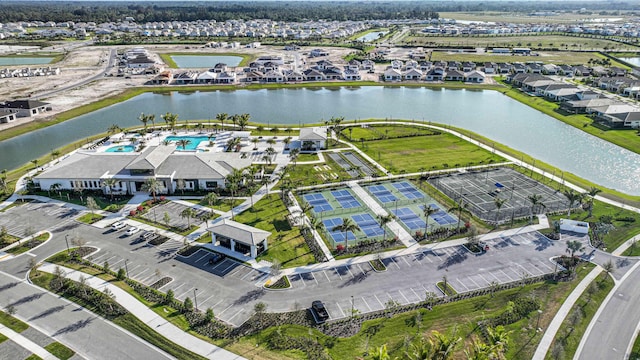 birds eye view of property featuring a water view