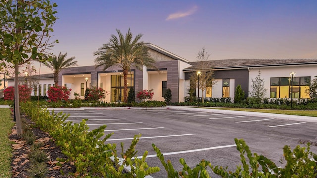 view of outdoor building at dusk