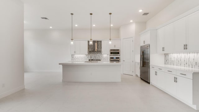 5237 Saint Vincent Ln, Westlake, FL 33470 - kitchen featuring appliances with stainless steel finishes, wall chimney exhaust hood, backsplash, white cabinets, and recessed lighting