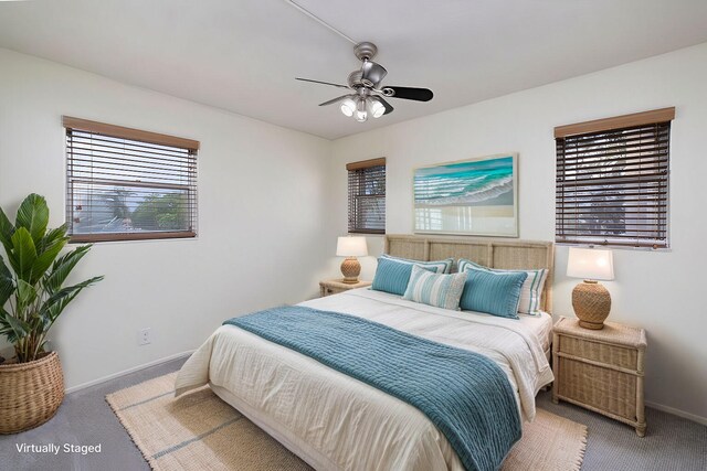 carpeted bedroom with ceiling fan