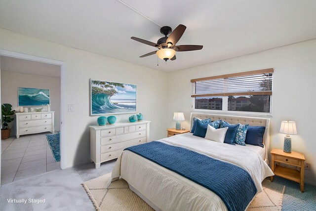 carpeted bedroom with ceiling fan