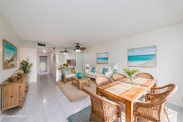 tiled dining space with ceiling fan