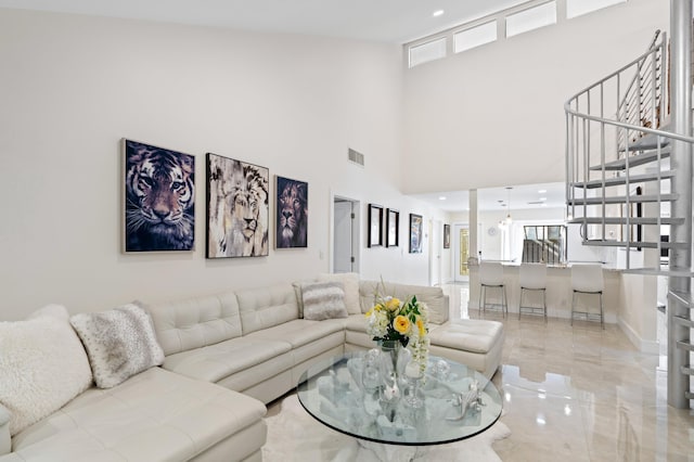 living room with a high ceiling