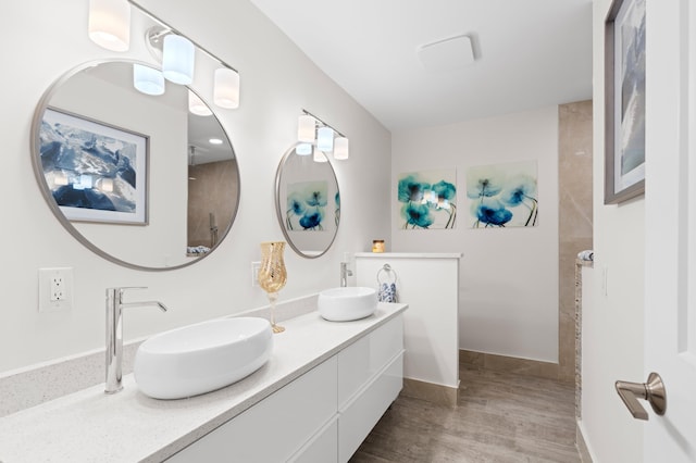 bathroom with vanity and wood-type flooring