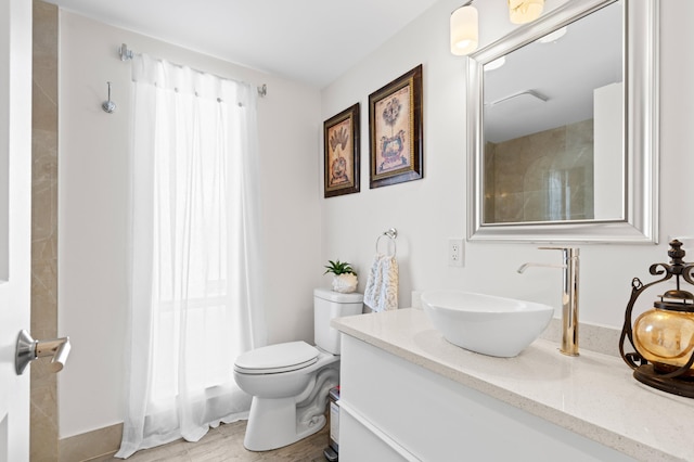 bathroom with vanity and toilet