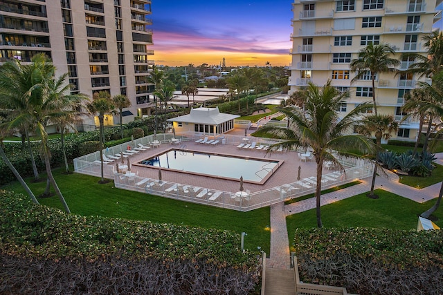 view of pool at dusk