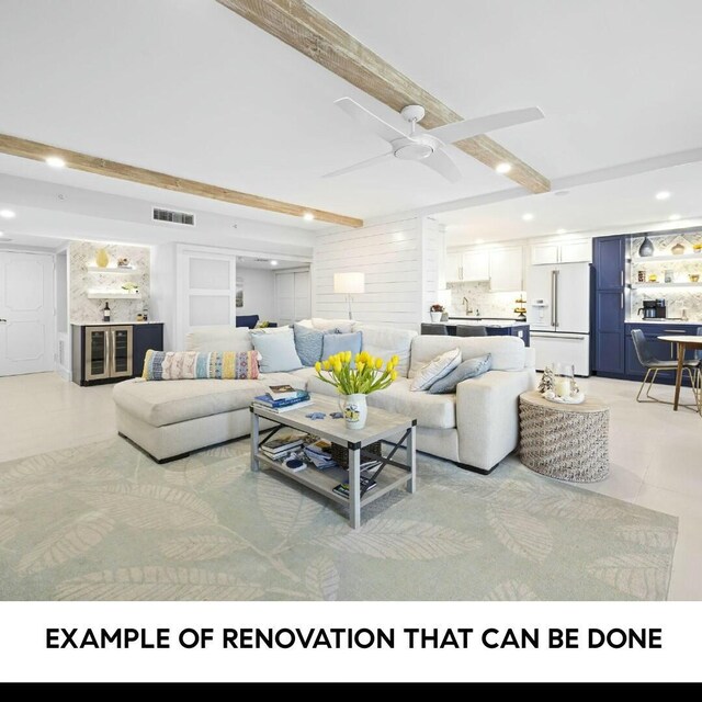 living room with ceiling fan and beam ceiling