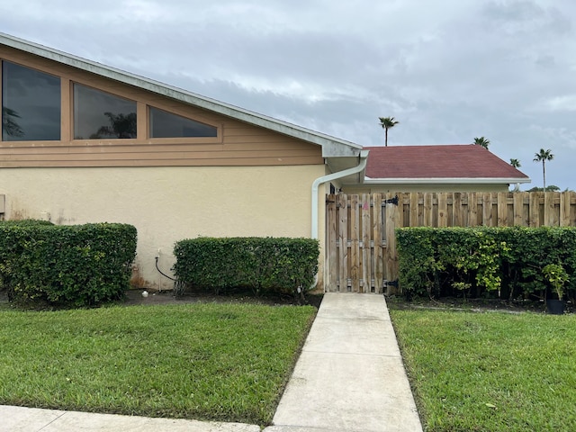 view of side of home featuring a yard