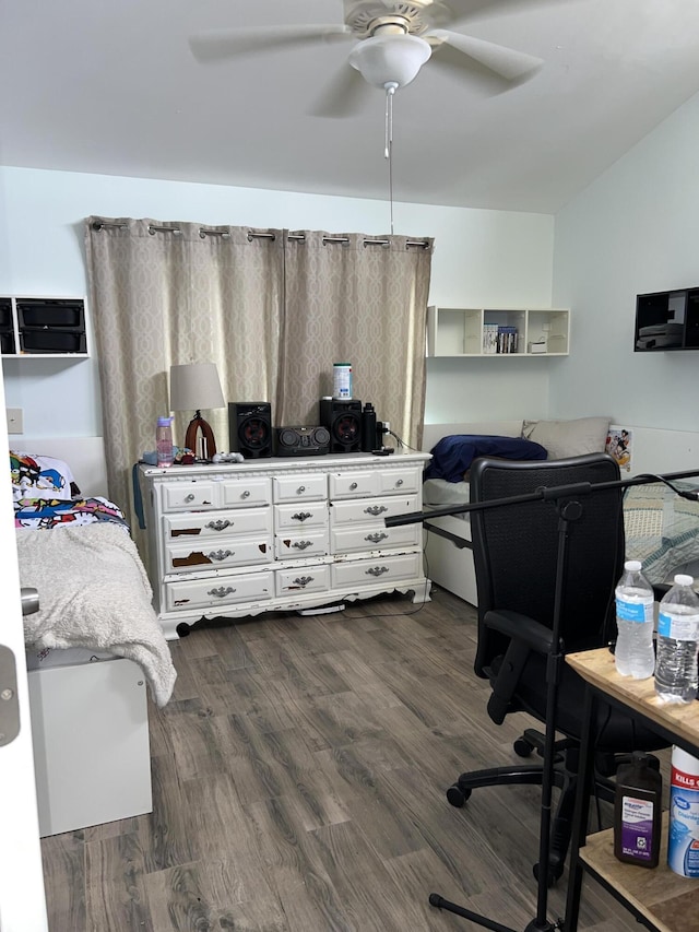 bedroom with lofted ceiling, ceiling fan, and dark wood-style flooring
