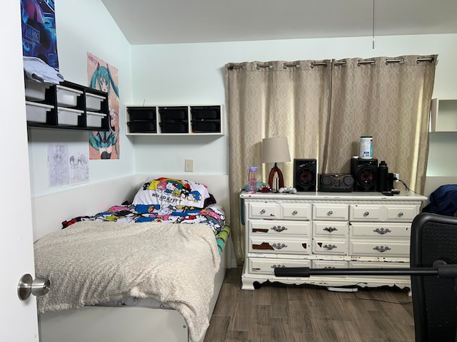 bedroom featuring dark wood-type flooring