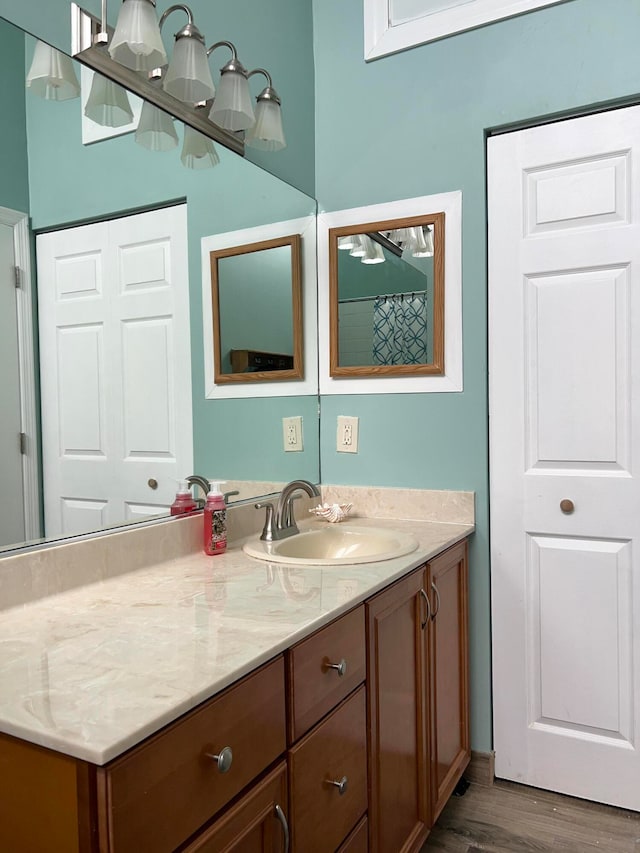 bathroom featuring vanity and hardwood / wood-style floors