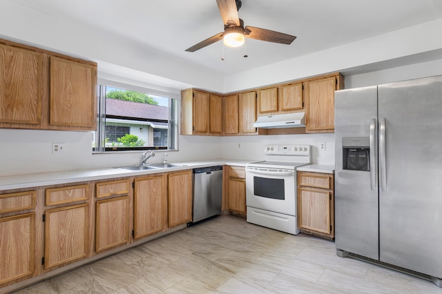 kitchen with appliances with stainless steel finishes, sink, and ceiling fan