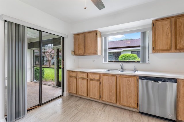 4360 Eucalyptus Tree Ct Unit A, Boynton Beach, FL 33436 - kitchen with ceiling fan, brown cabinetry, stainless steel dishwasher, a sink, and light countertops