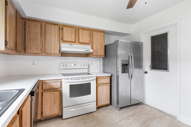 kitchen with ceiling fan, sink, and stainless steel appliances