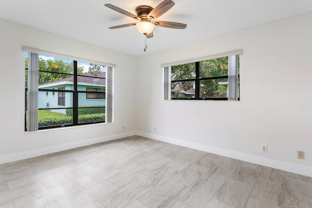 4360 Eucalyptus Tree Ct Unit A, Boynton Beach, FL 33436 - empty room featuring baseboards and a ceiling fan