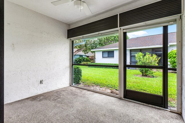 unfurnished sunroom with ceiling fan and a wealth of natural light