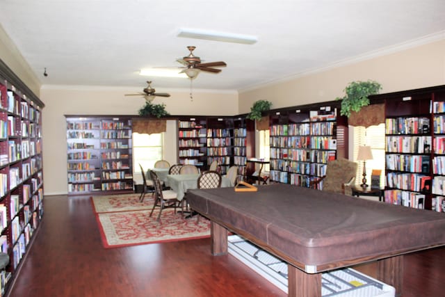 game room with ornamental molding, billiards, and dark hardwood / wood-style flooring