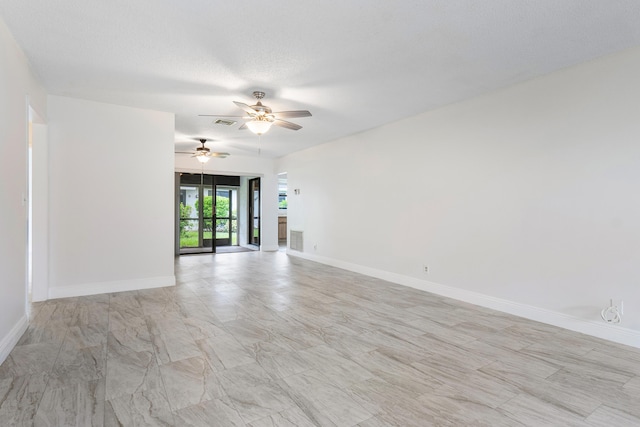 4360 Eucalyptus Tree Ct Unit A, Boynton Beach, FL 33436 - spare room with baseboards, a ceiling fan, marble finish floor, and visible vents