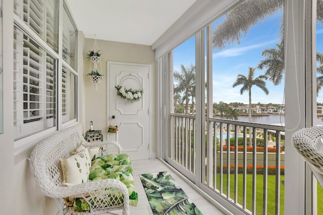 sunroom with a water view