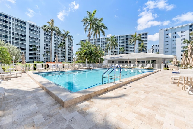 view of swimming pool featuring a patio area