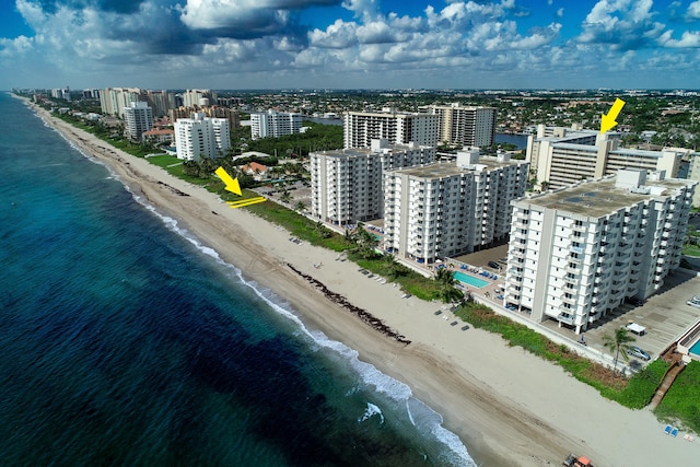 bird's eye view featuring a beach view and a water view