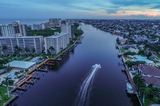 aerial view at dusk with a water view