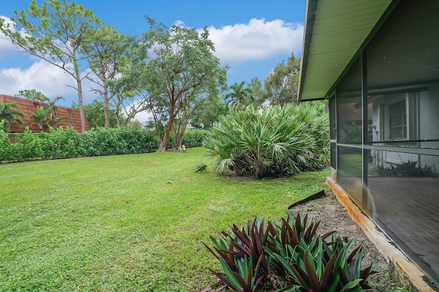 view of yard with a sunroom