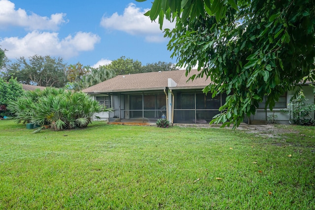 view of yard with a sunroom