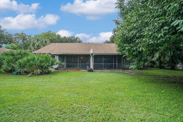 view of yard with a sunroom