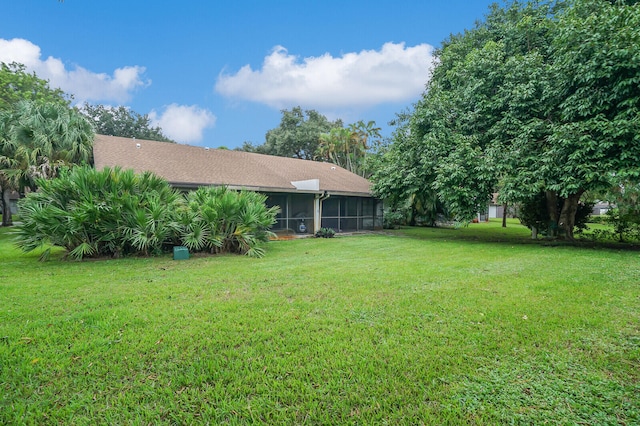 view of yard featuring a sunroom