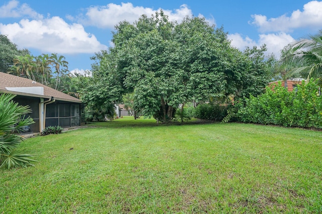 view of yard featuring a sunroom