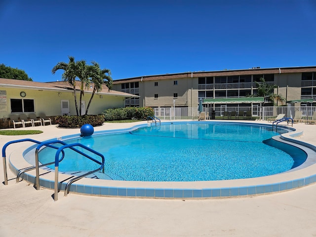 view of swimming pool with a patio area