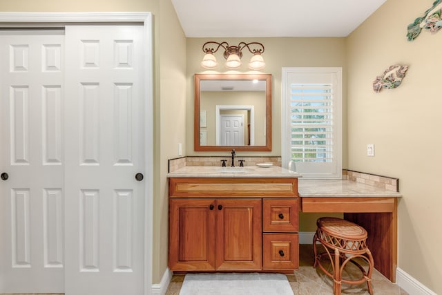 bathroom with tile patterned floors and vanity