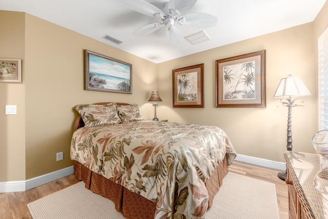 bedroom featuring ceiling fan and light hardwood / wood-style flooring