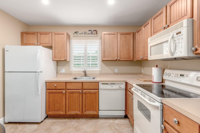 kitchen with white appliances and sink