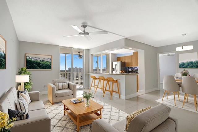 living room with light tile patterned floors and ceiling fan