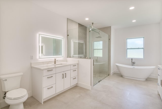 full bathroom featuring independent shower and bath, vanity, and toilet