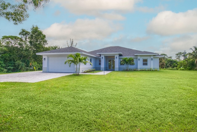 view of front of property featuring a front lawn and a garage