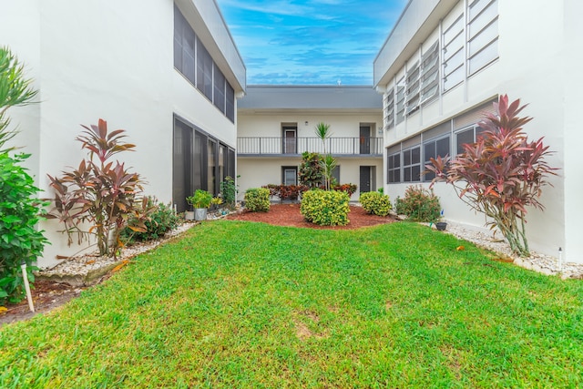 view of yard featuring a sunroom