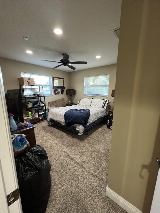 bedroom with ceiling fan and carpet flooring