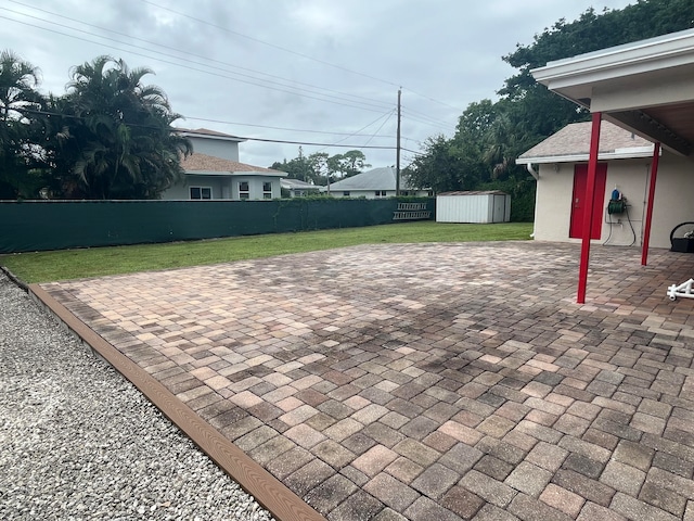 view of patio / terrace with a shed