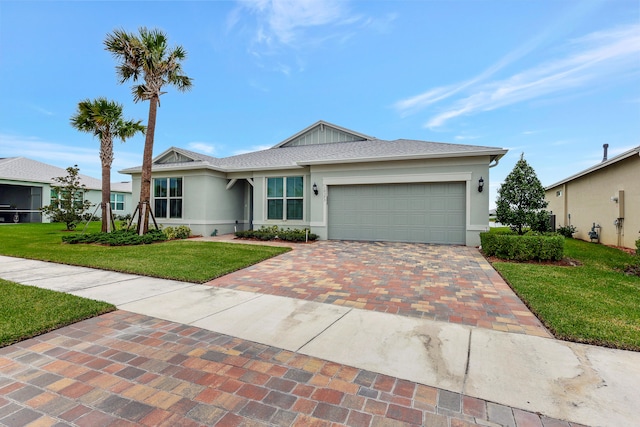 single story home featuring a garage and a front lawn